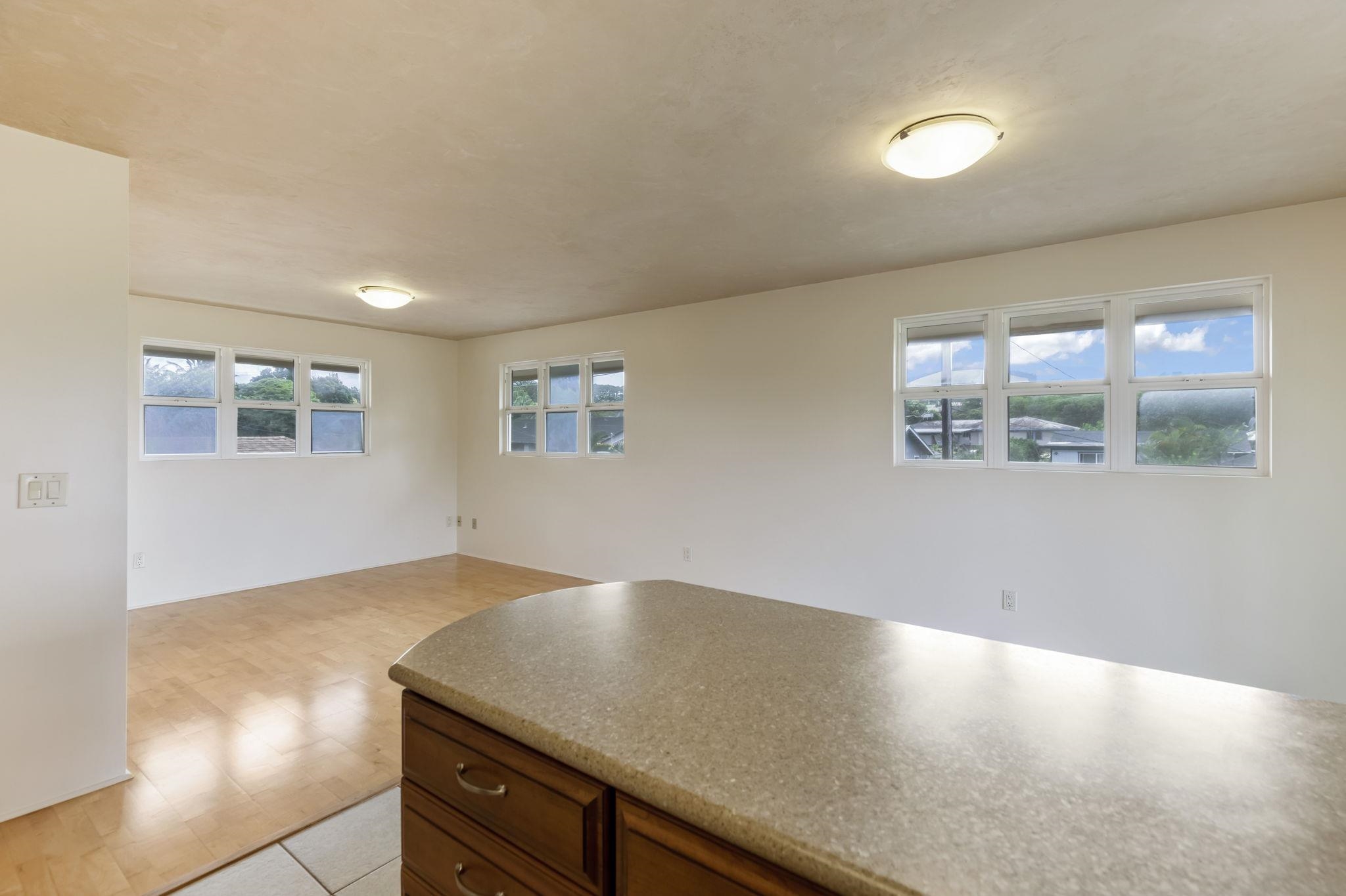 44 Pokoa Place Haiku, HI 96708 - Photo 13 of 29 a view of wooden floor and windows in a room