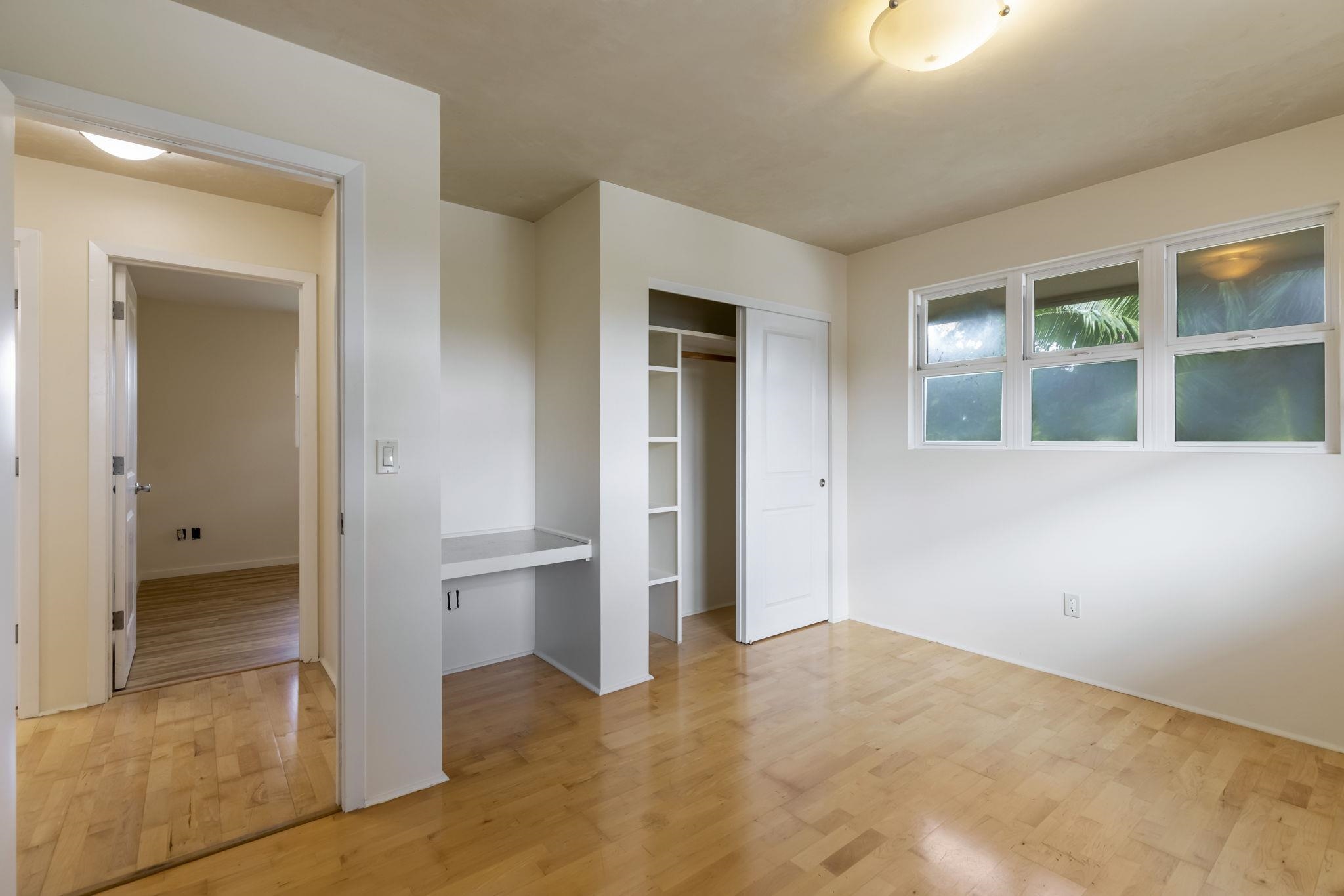44 Pokoa Place Haiku, HI 96708 - Photo 16 of 29 wooden floor and windows in a room