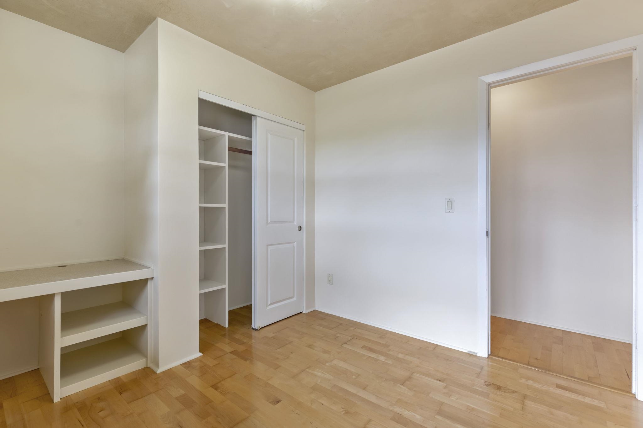 44 Pokoa Place Haiku, HI 96708 - Photo 19 of 29 a view of an empty room with wooden floor and closet
