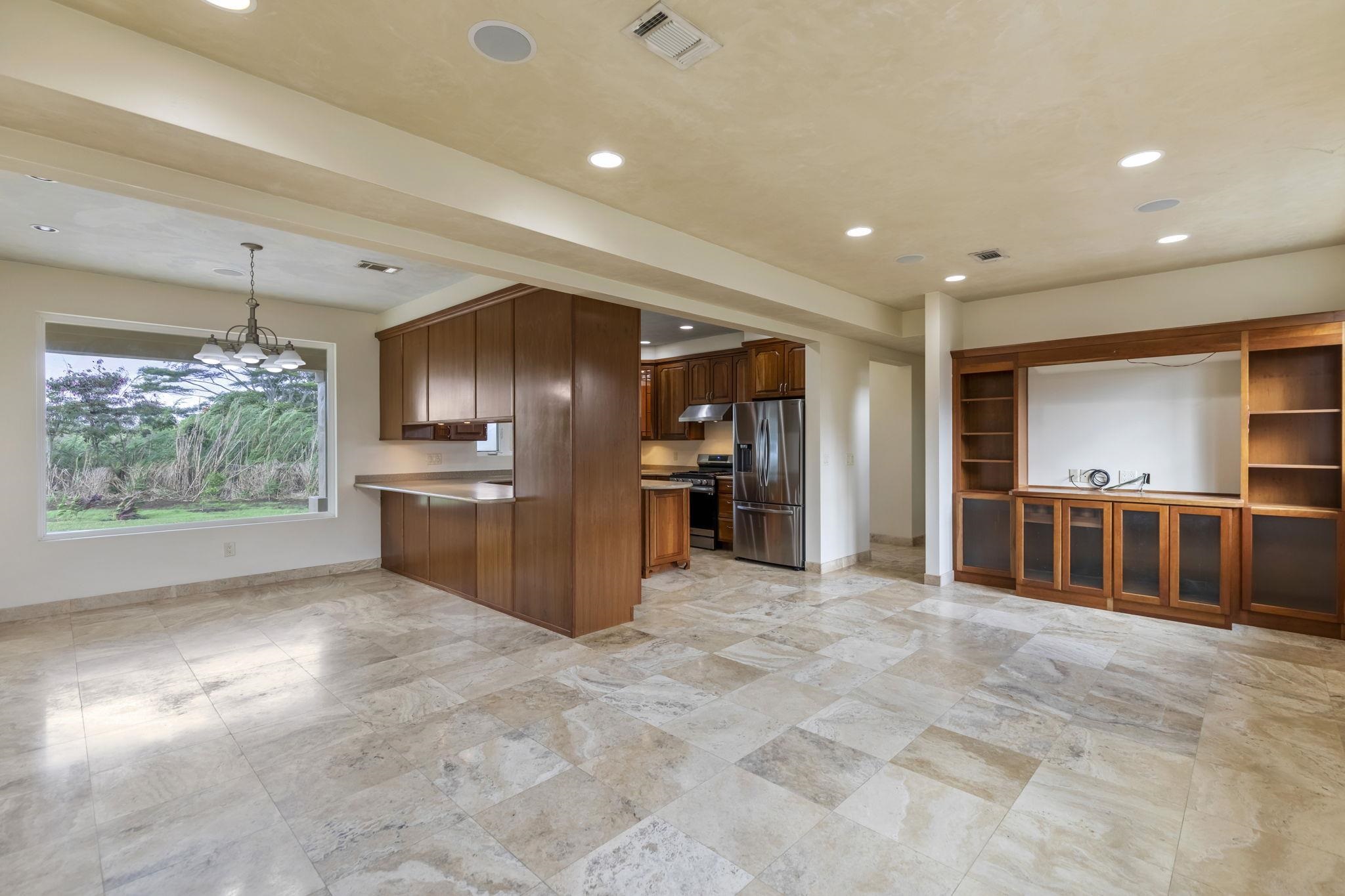 44 Pokoa Place Haiku, HI 96708 - Photo 3 of 29 a view of a kitchen with refrigerator and windows