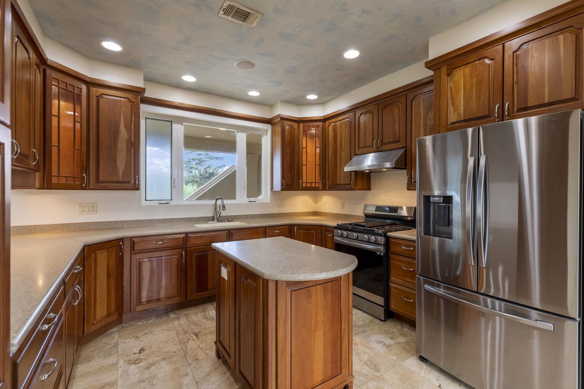 44 Pokoa Place Haiku, HI 96708 - Photo 4 of 29 a kitchen with stainless steel appliances granite countertop a refrigerator a sink dishwasher a stove and a refrigerator