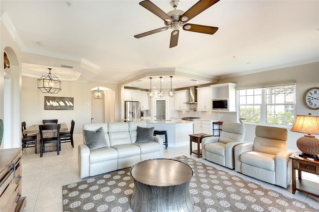 7482 Divot Loop, Unit 6A Bradenton, FL 34202 - Photo 13 of 33 a living room with furniture and a large window