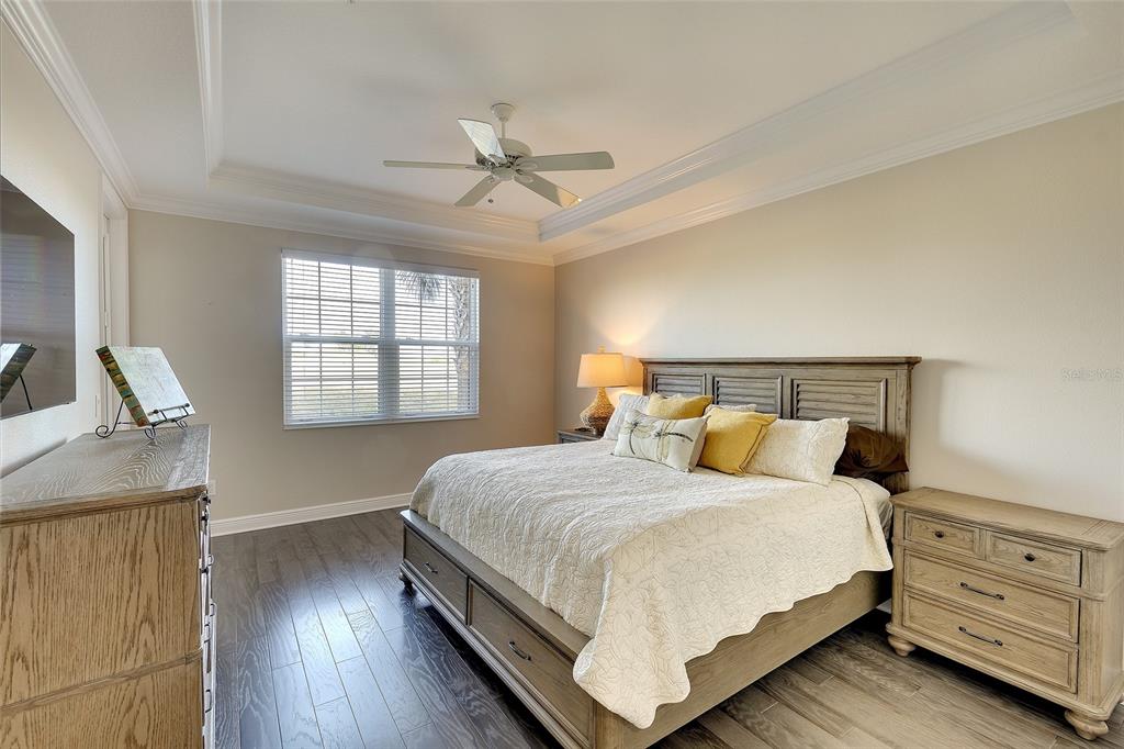 7482 Divot Loop, Unit 6A Bradenton, FL 34202 - Photo 22 of 33 a bedroom with a bed and window