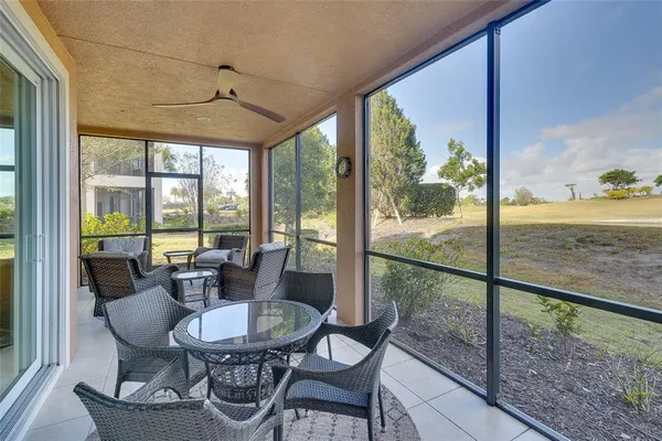 a view of a dining room with furniture window and outside view