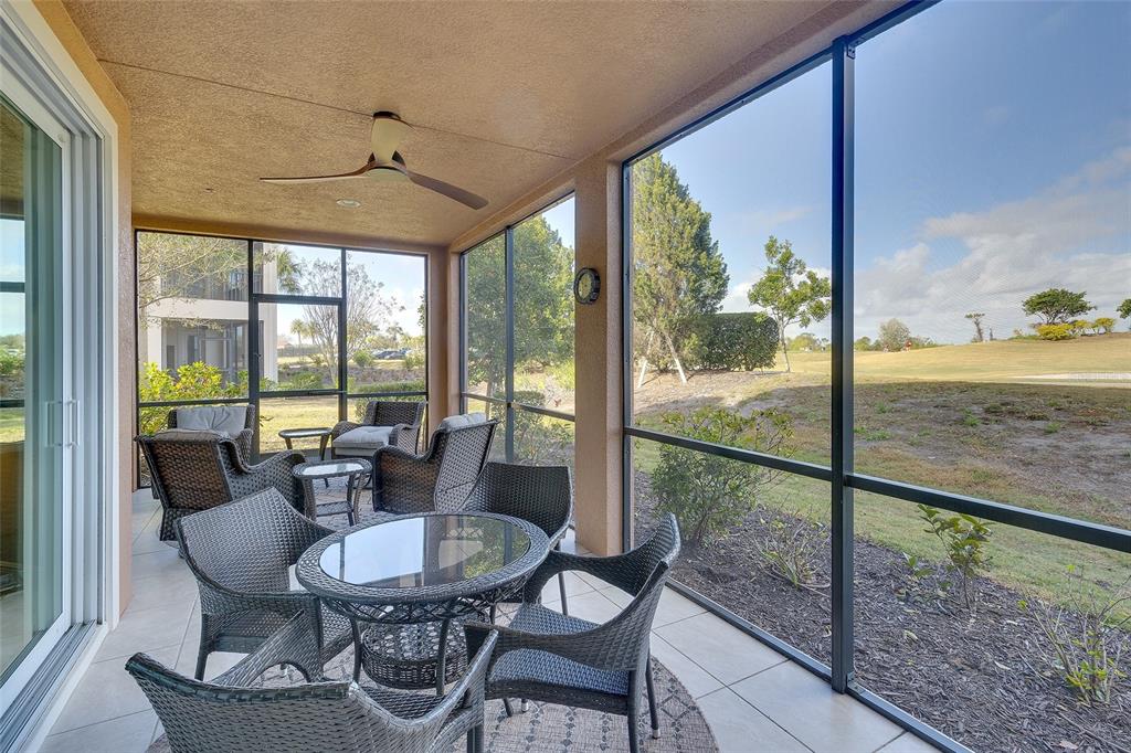 7482 Divot Loop, Unit 6A Bradenton, FL 34202 - Photo 5 of 33 a view of a dining room with furniture window and outside view