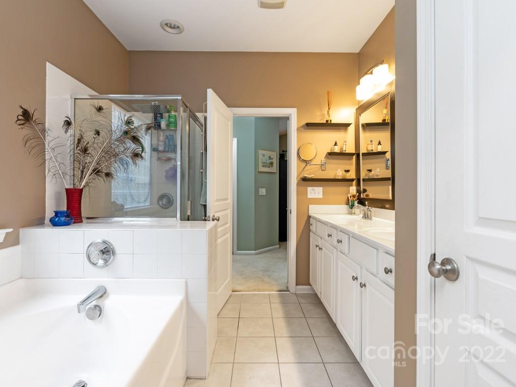 392 Sand Paver Way Fort Mill, SC 29708 - Photo 12 of 35 a spacious bathroom with a tub sink and mirror