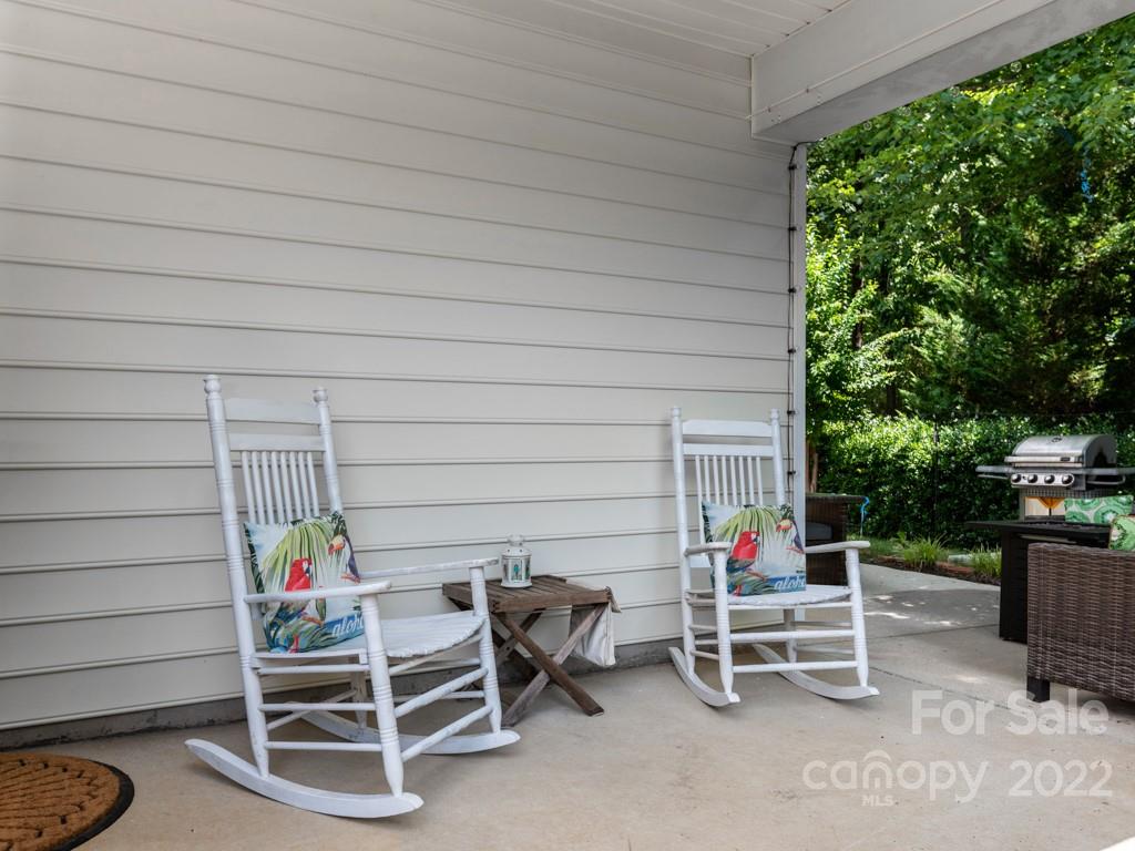392 Sand Paver Way Fort Mill, SC 29708 - Photo 21 of 35 a wooden bench sitting in backside of a house