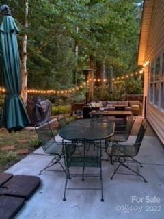 392 Sand Paver Way Fort Mill, SC 29708 - Photo 29 of 35 a view of a backyard with table and chairs and potted plants