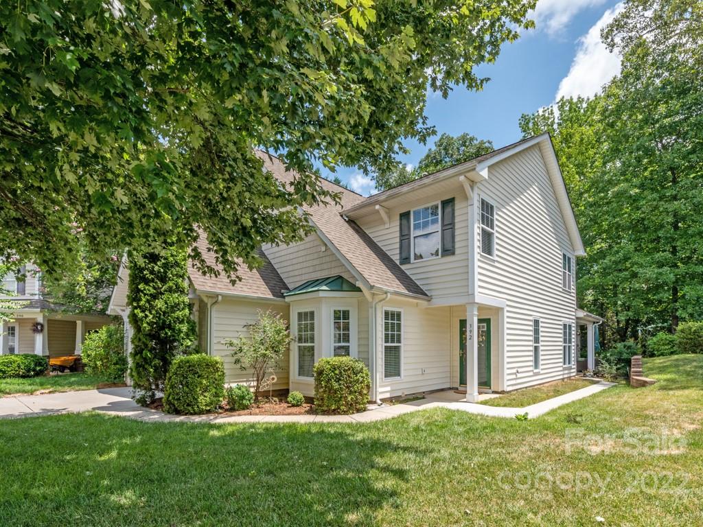 392 Sand Paver Way Fort Mill, SC 29708 - Photo 31 of 35 a front view of a house with a yard and trees