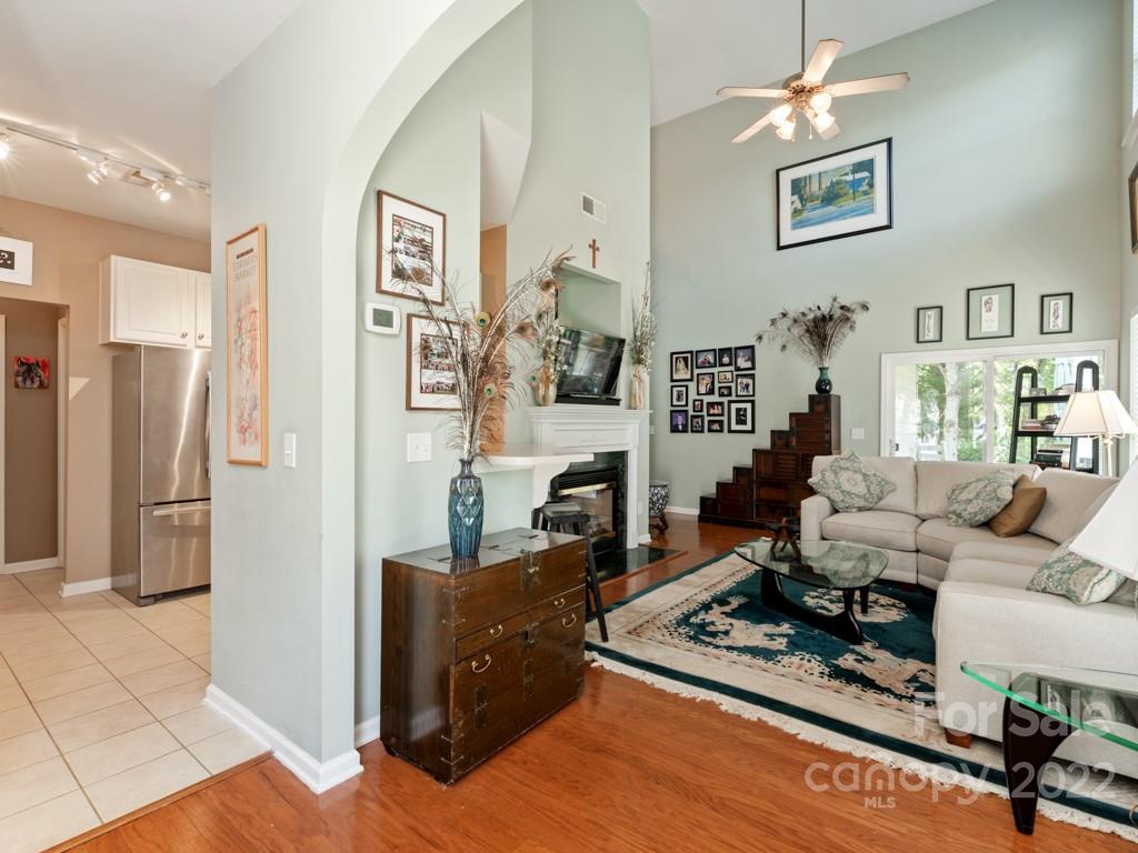 392 Sand Paver Way Fort Mill, SC 29708 - Photo 5 of 35 a living room with furniture hard wood floor and a fireplace