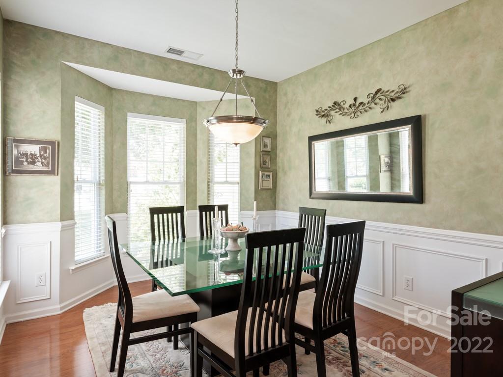 392 Sand Paver Way Fort Mill, SC 29708 - Photo 6 of 35 a view of a dining room with furniture window and wooden floor
