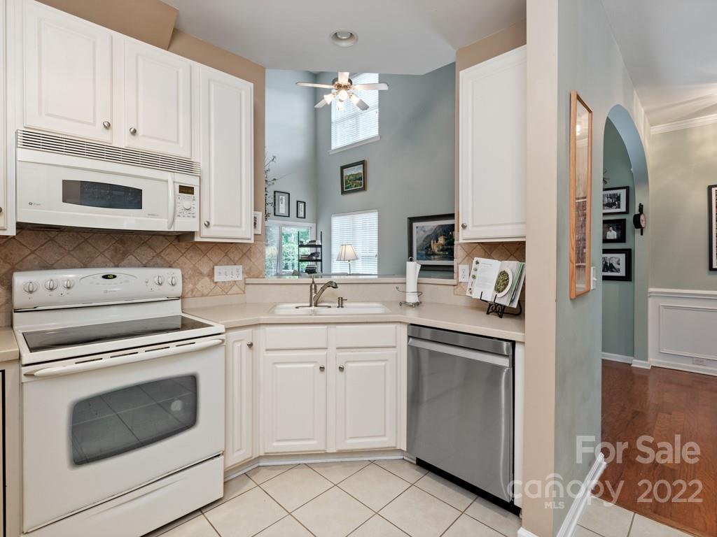 392 Sand Paver Way Fort Mill, SC 29708 - Photo 8 of 35 a kitchen with cabinets stainless steel appliances and a sink