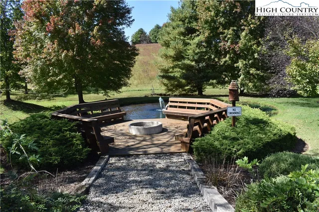 a view of a house with entertaining space and a car park in front of it