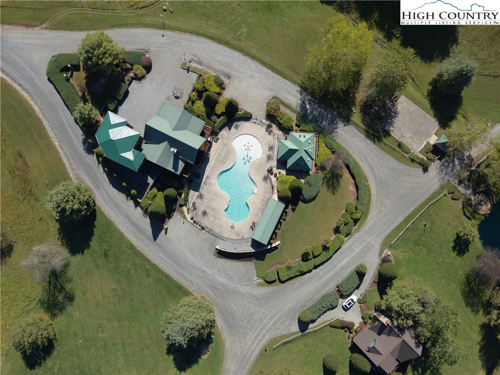 46 Bear Xing Road Sparta, NC 28675 - Photo 4 of 18 an aerial view of a house with a swimming pool