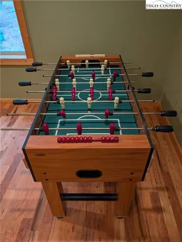 a view of a roof deck with wooden floor and fence