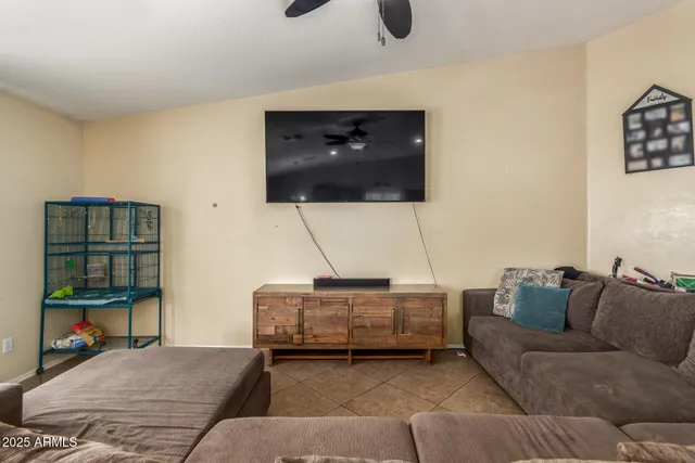 a living room with a couch and a flat screen tv