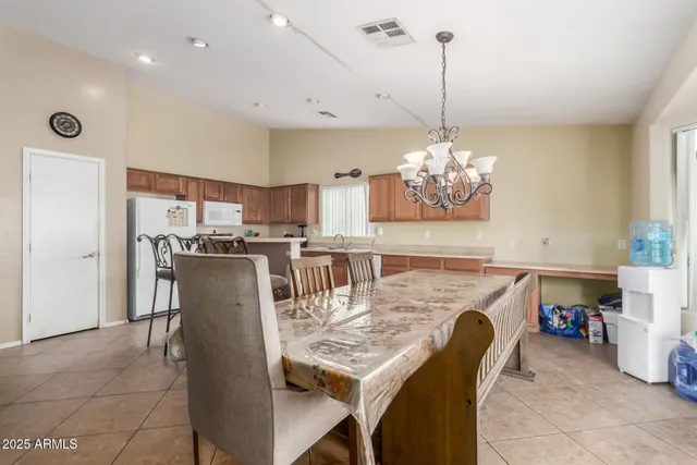 a dining room filled with furniture and window