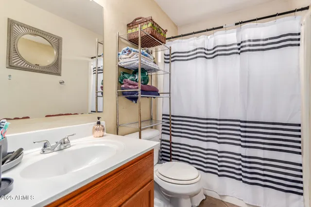 a bathroom with a sink a vanity and mirror