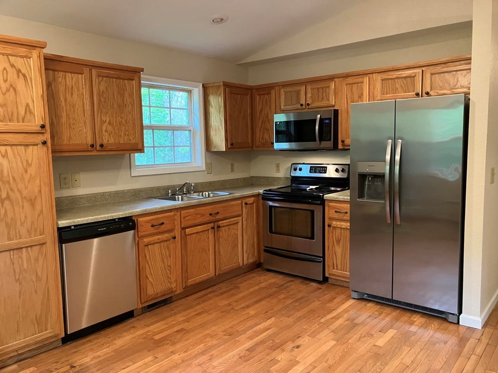 67 Brandys Way Murphy, NC 28906 - Photo 5 of 14 a kitchen with stainless steel appliances granite countertop a refrigerator stove top oven and sink