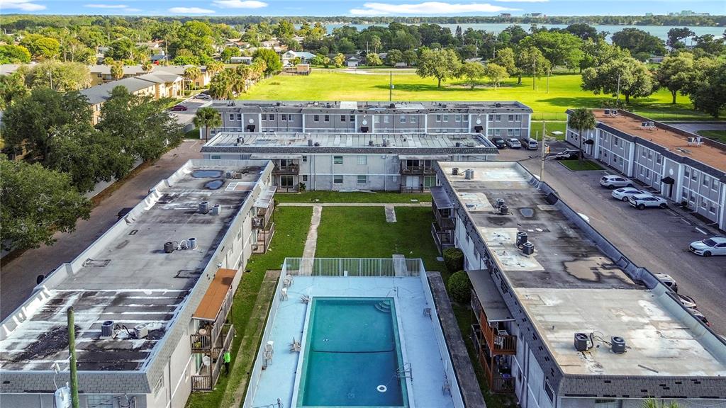 2753 L B McLeod Road, Unit D Orlando, FL 32805 - Photo 38 of 48 a view of a swimming pool with a lake view