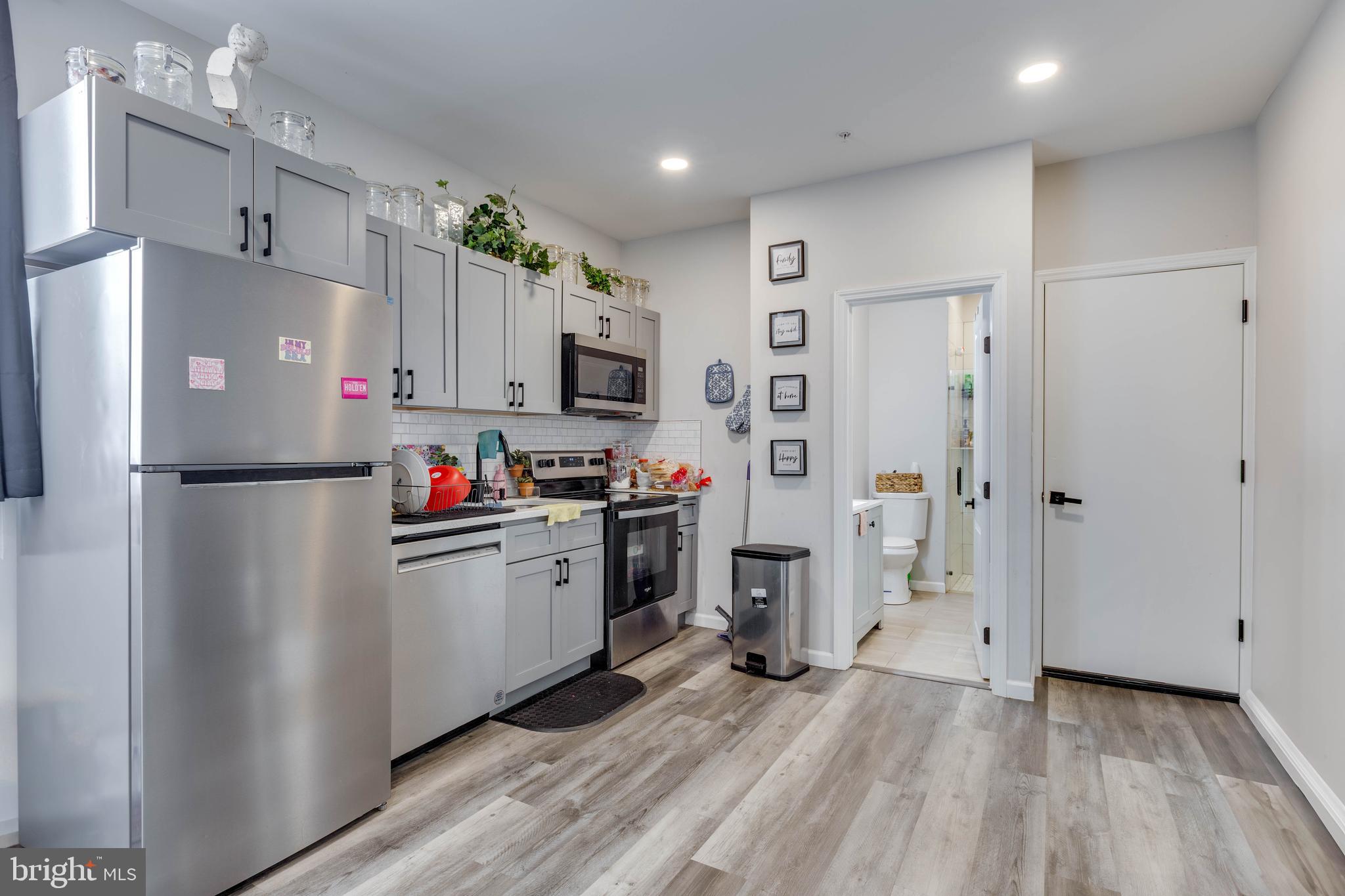 623 West Oxford Street Philadelphia, PA 19122 - Photo 13 of 26 a kitchen with stainless steel appliances a refrigerator sink and microwave