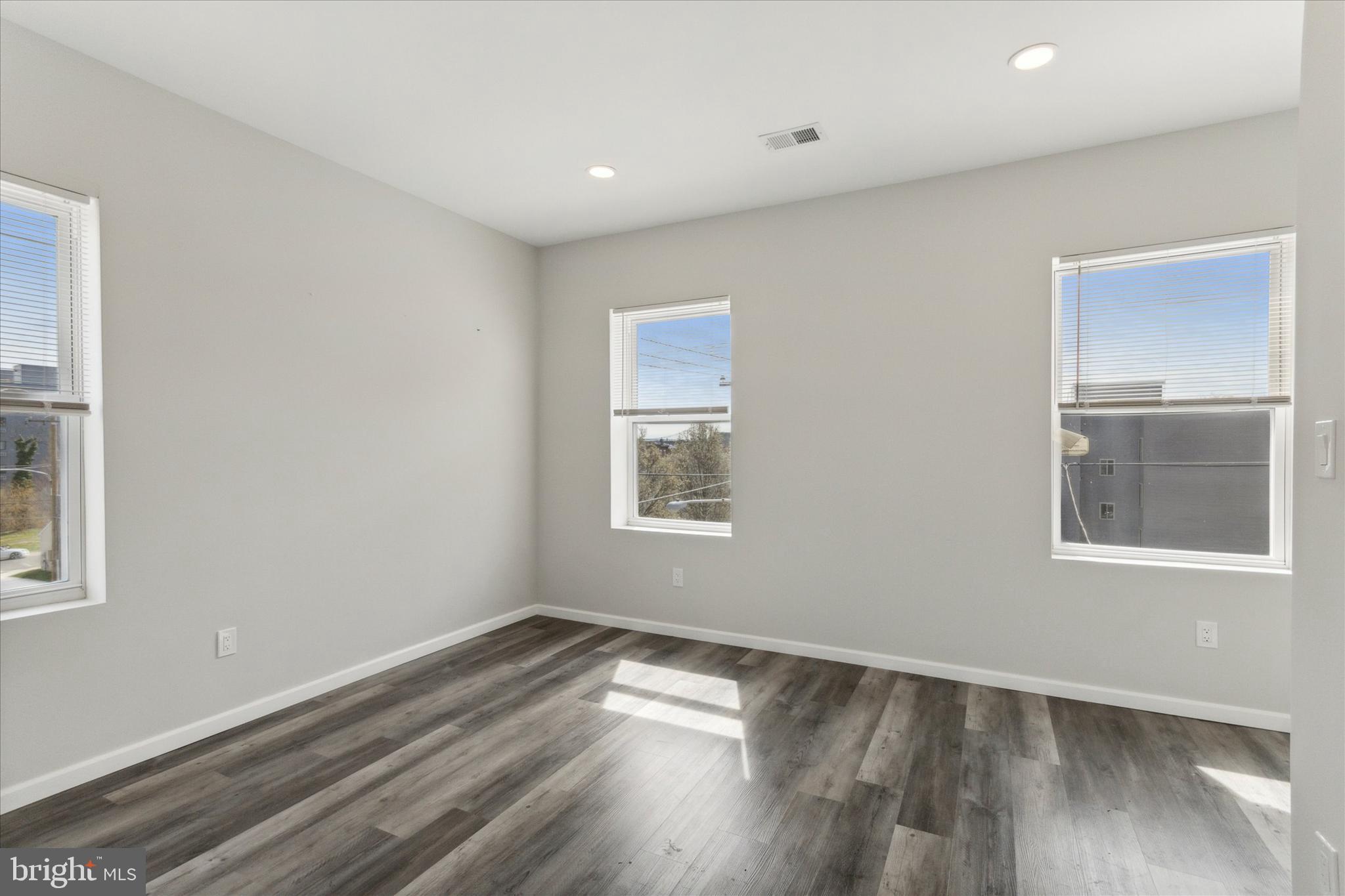 623 West Oxford Street Philadelphia, PA 19122 - Photo 15 of 26 a view of an empty room with wooden floor and a window