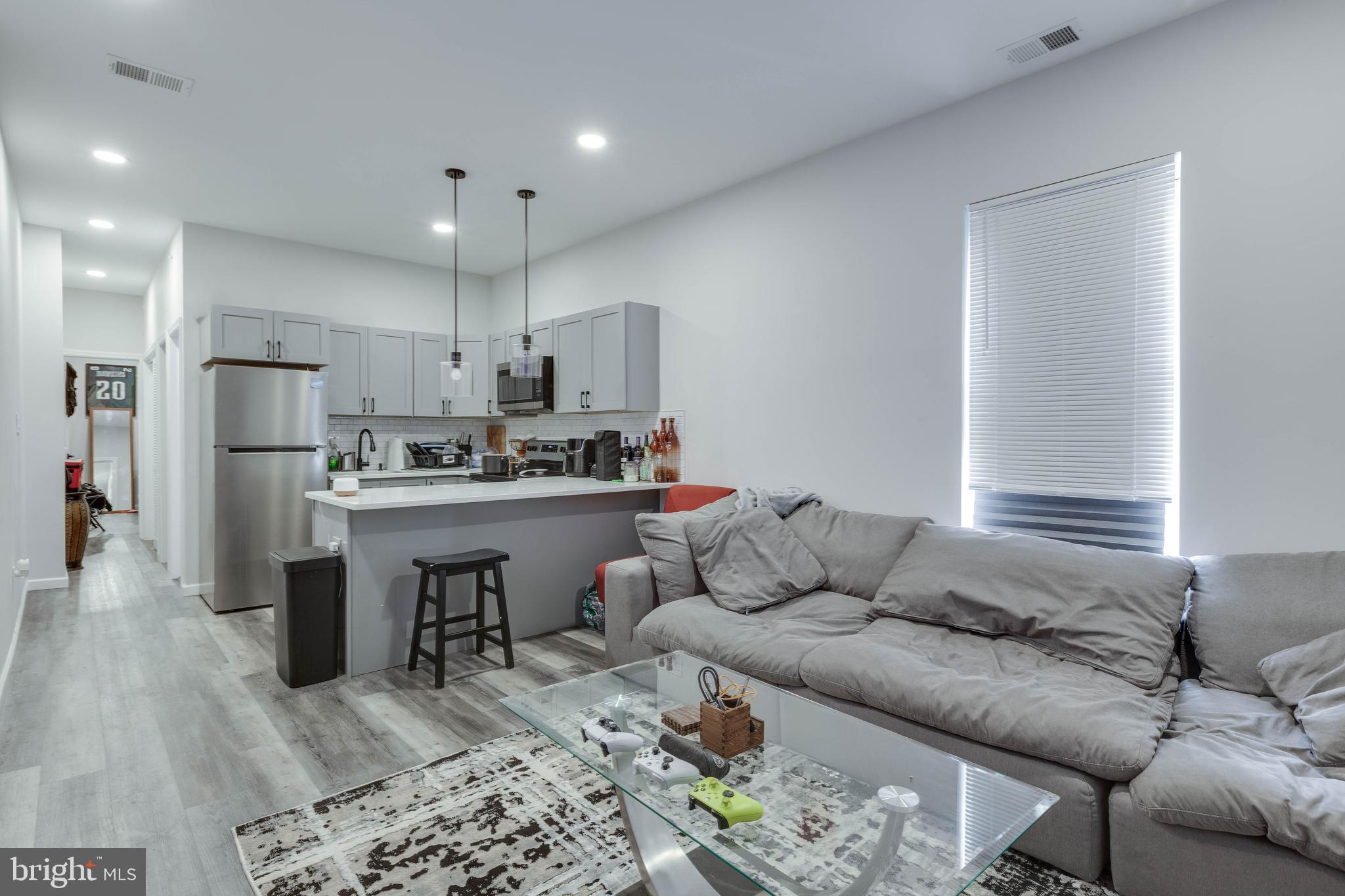 623 West Oxford Street Philadelphia, PA 19122 - Photo 6 of 26 a living room with furniture and kitchen view