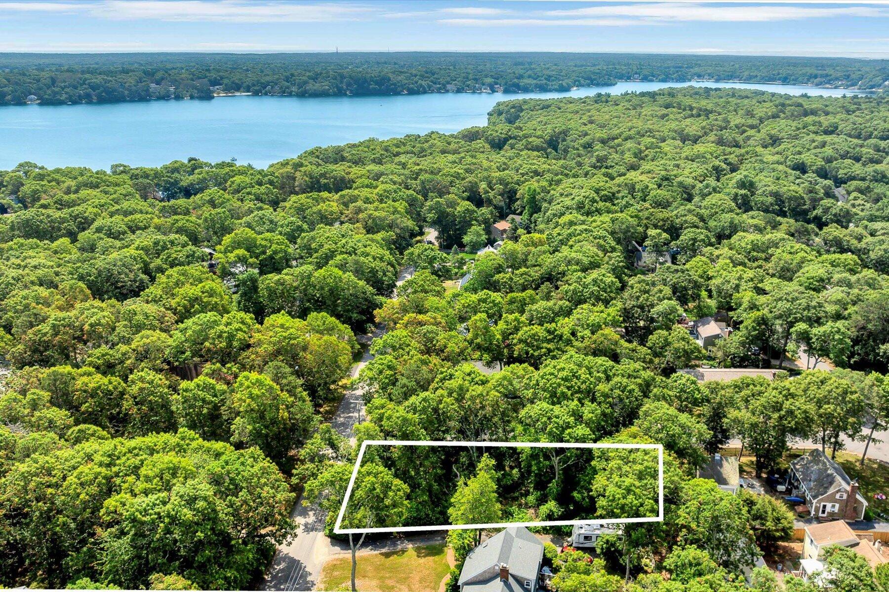 66 Highland Street Mashpee, MA 02649 - Photo 4 of 9 a view of a yard and lake view