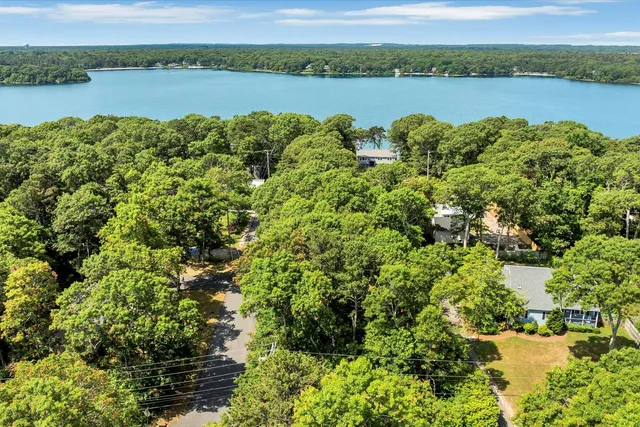 a large body of water with a building in the background