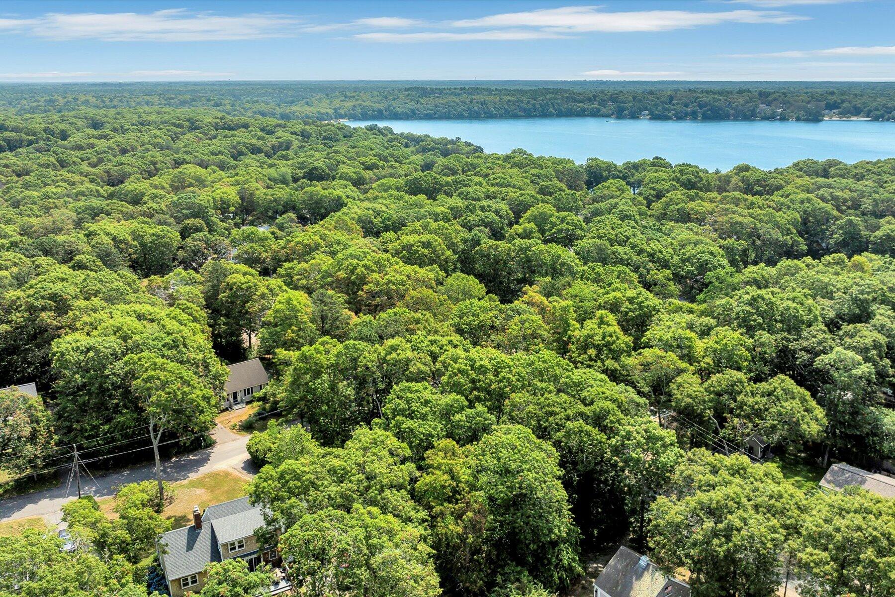 66 Highland Street Mashpee, MA 02649 - Photo 6 of 9 a view of a lake with a city