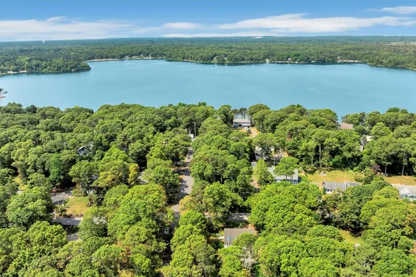 a view of a lake with houses in the back