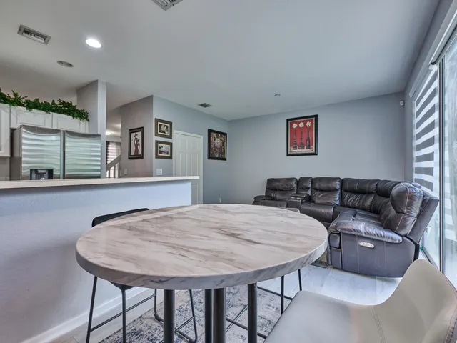 a bathroom with a sink a potted plant and a mirror