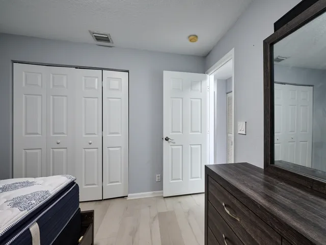 an aerial view of a building with garden space and street view