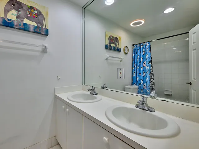 an aerial view of a houses with outdoor space and street view