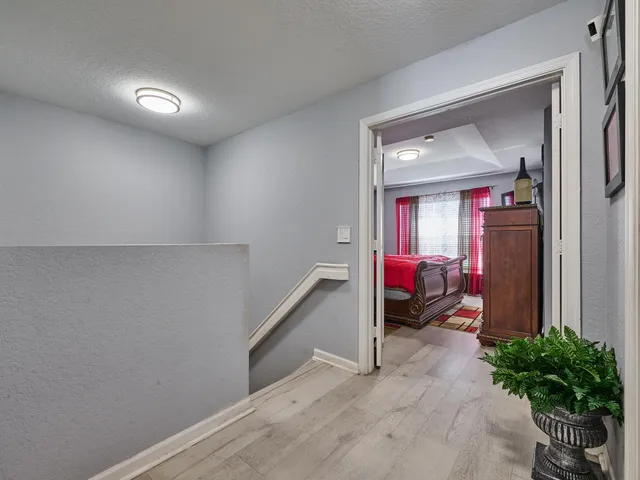 an aerial view of multiple houses with a yard