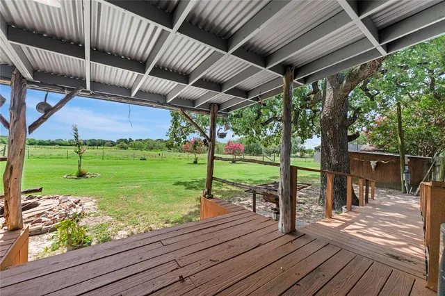 a view of a backyard with sitting area