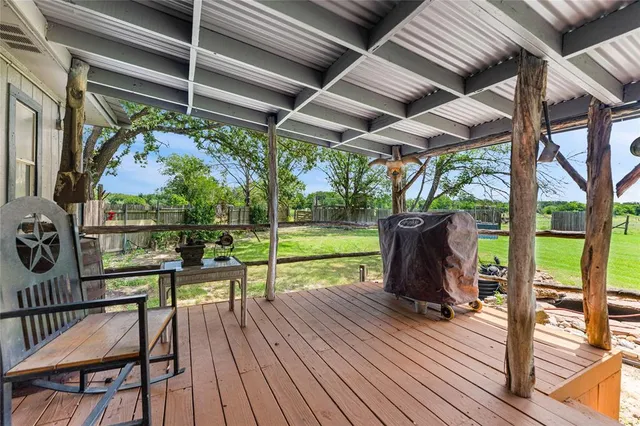 a view of sitting area with furniture and wooden floor