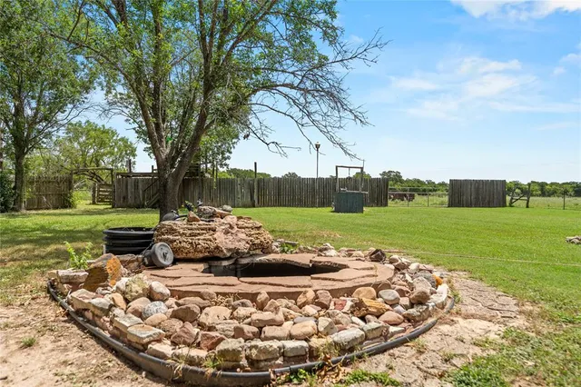 a view of a garden with an outdoor space