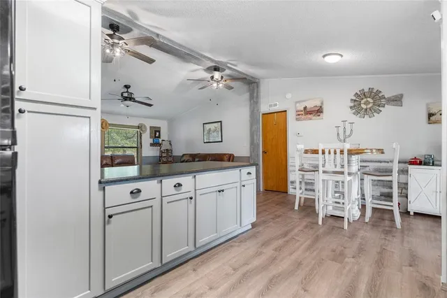 a spacious bathroom with a double vanity sink and a window
