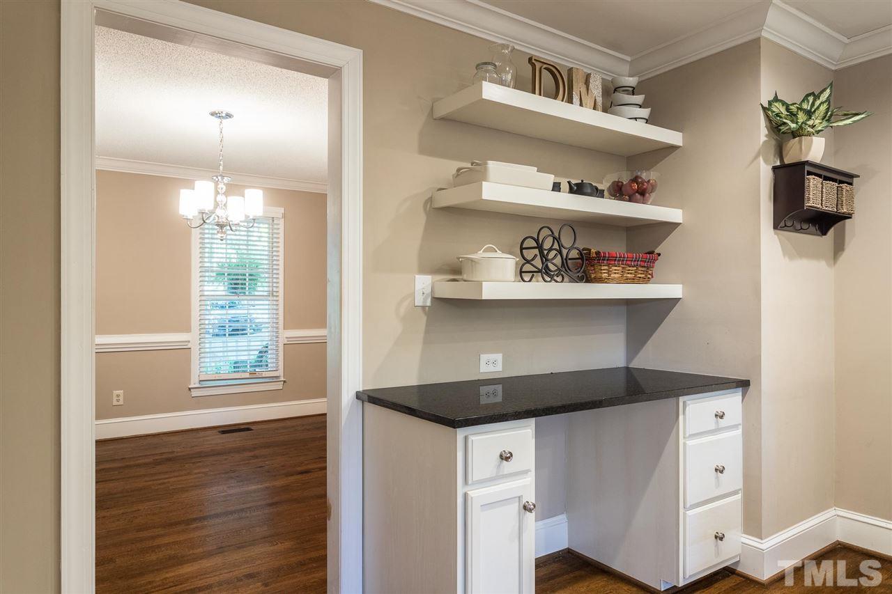 1025 Sawmill Road Raleigh, NC 27615 - Photo 11 of 25 a kitchen with a cabinets and wooden floor