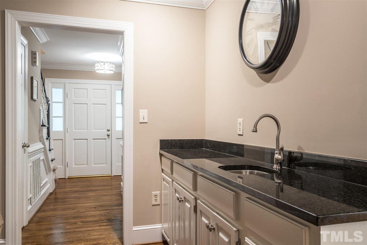 1025 Sawmill Road Raleigh, NC 27615 - Photo 12 of 25 a close view of a sink and a mirror in a bathroom