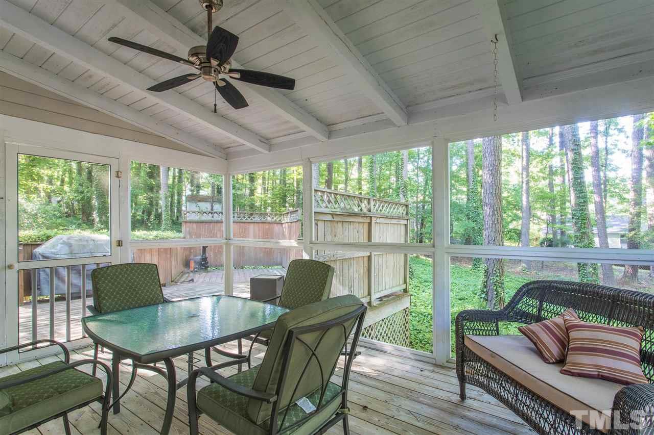 1025 Sawmill Road Raleigh, NC 27615 - Photo 24 of 25 a view of a dining room with furniture window and outside view