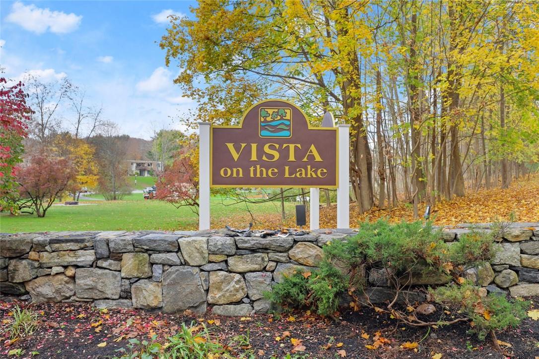 711 Vista On The Lake Carmel, NY 10512 - Photo 1 of 1 a view of sign board with yard and ocean view