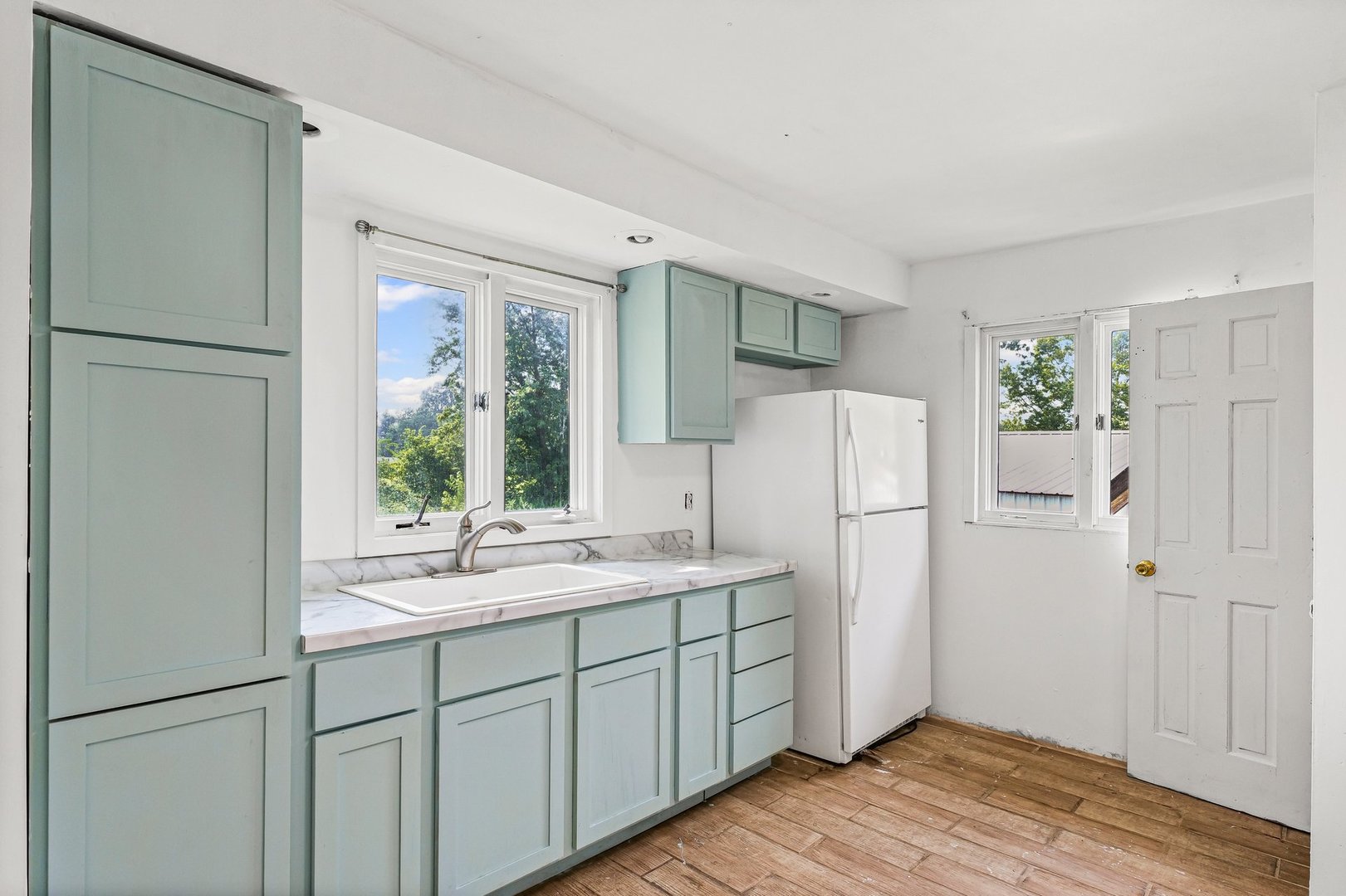 3609 Artesian Avenue Armstrong, IL 61812 - Photo 12 of 32 a kitchen with a refrigerator a sink and cabinets