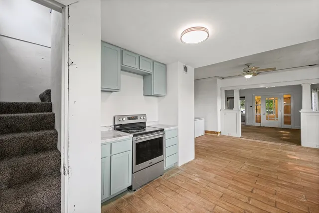 a kitchen with stainless steel appliances granite countertop a stove and a refrigerator