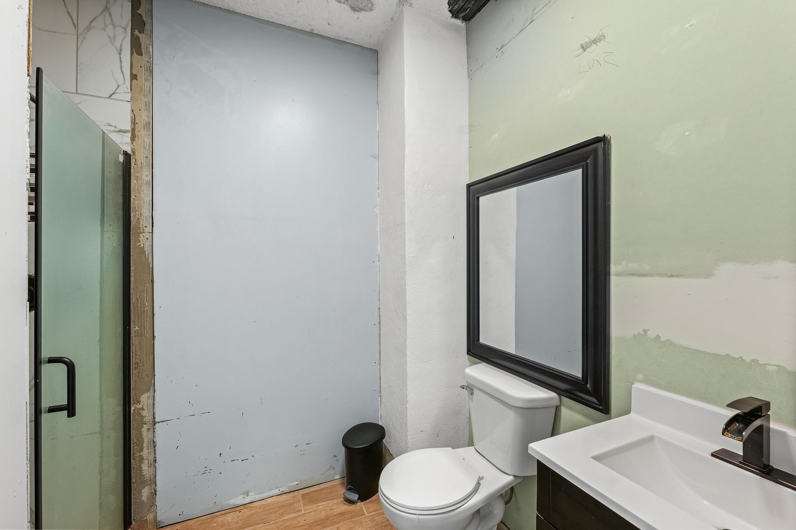 3609 Artesian Avenue Armstrong, IL 61812 - Photo 17 of 32 a bathroom with a toilet a sink and mirror