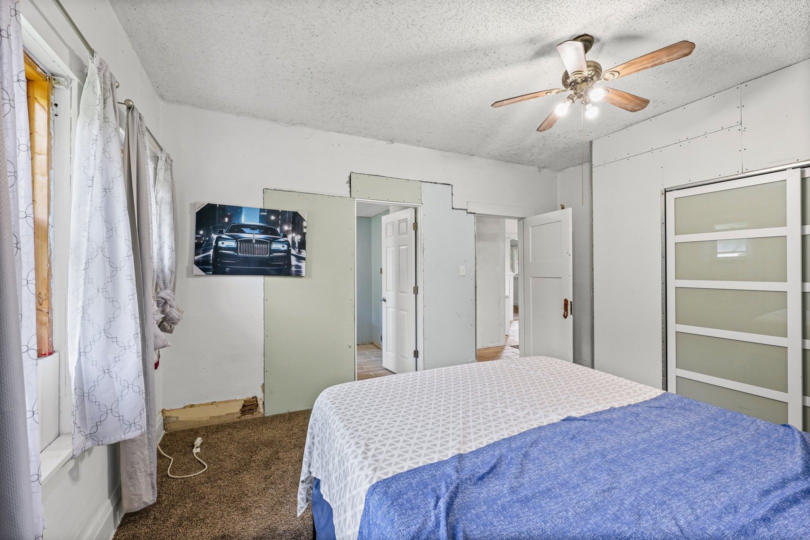 3609 Artesian Avenue Armstrong, IL 61812 - Photo 19 of 32 a bedroom with a bed and a chandelier