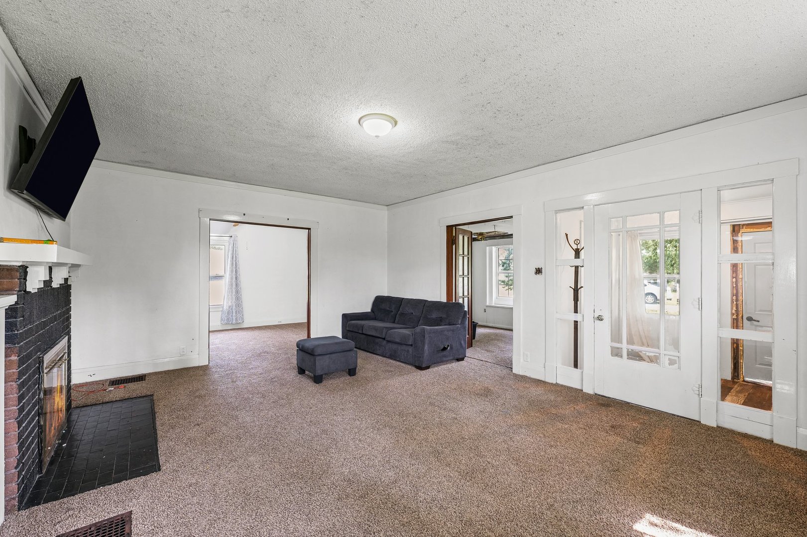 3609 Artesian Avenue Armstrong, IL 61812 - Photo 8 of 32 a living room with furniture and a flat screen tv