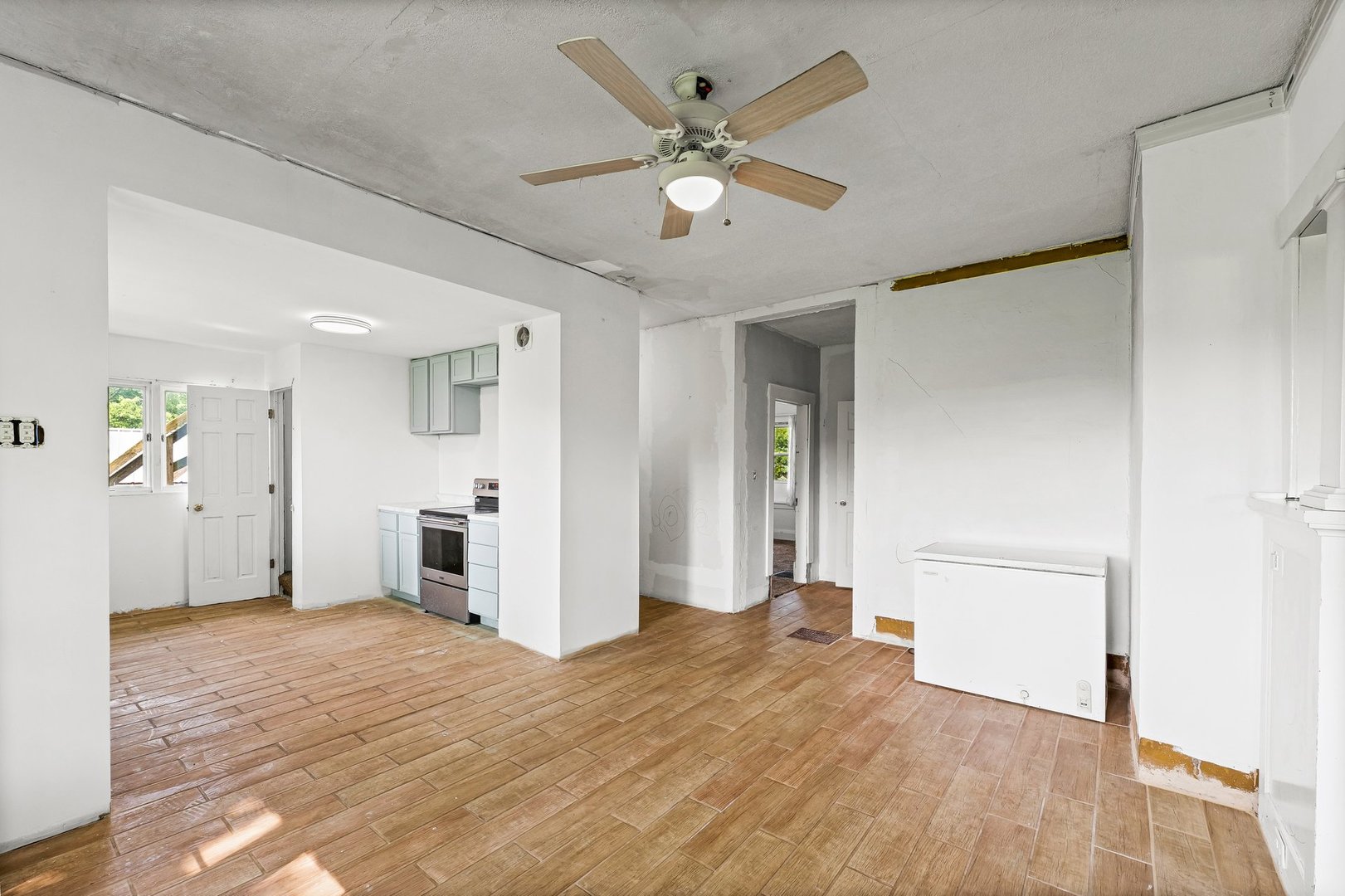 3609 Artesian Avenue Armstrong, IL 61812 - Photo 9 of 32 a view of a livingroom with a chandelier fan and wooden floor