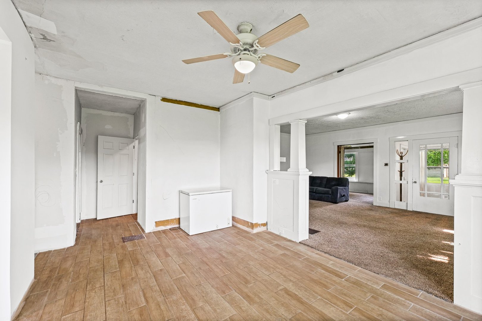 3609 Artesian Avenue Armstrong, IL 61812 - Photo 10 of 32 a view of a livingroom with wooden floor and a ceiling fan